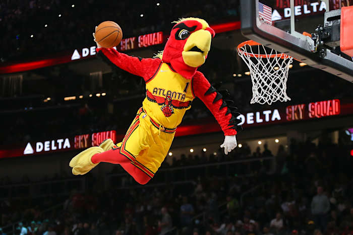 Atlanta Hawks mascot dunks during a timeout.